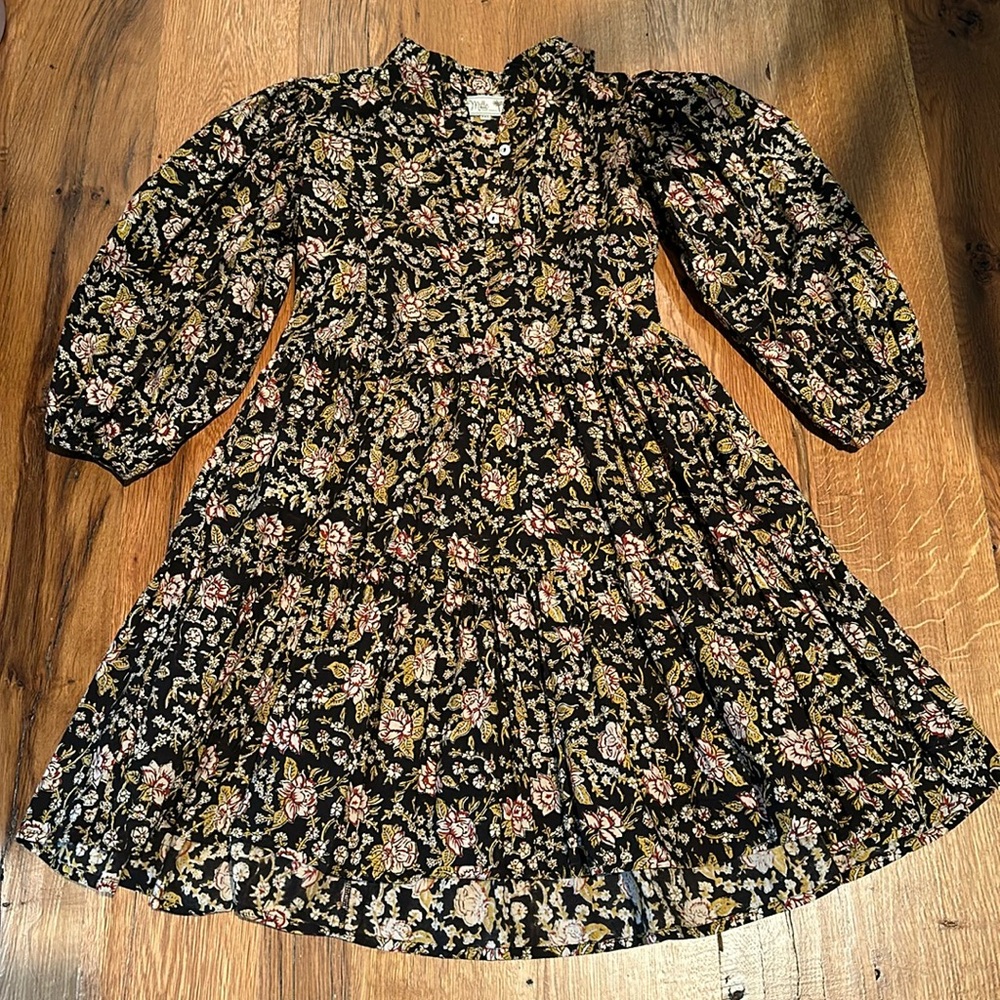Mille Sundress. Hits above knee, sleeve are a slight puff and hit above wrist.